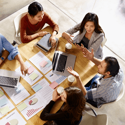A birds eye view of Clearlinkers gathered in a meeting